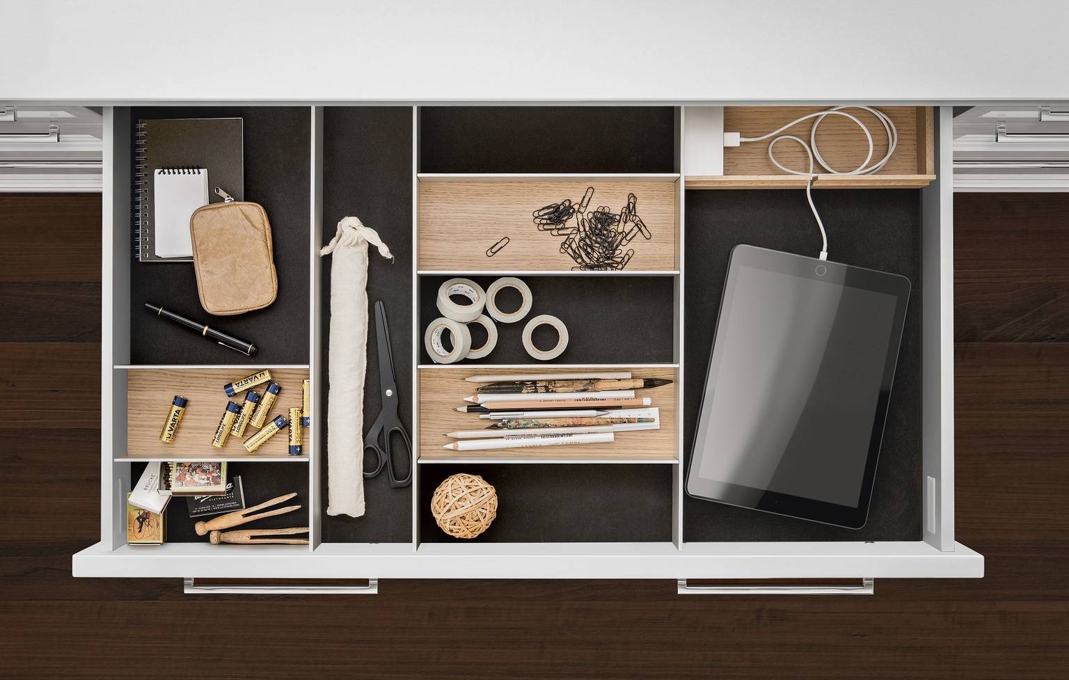 SieMatic GripDeck in kitchen drawers has a secure hold on pots and pans.